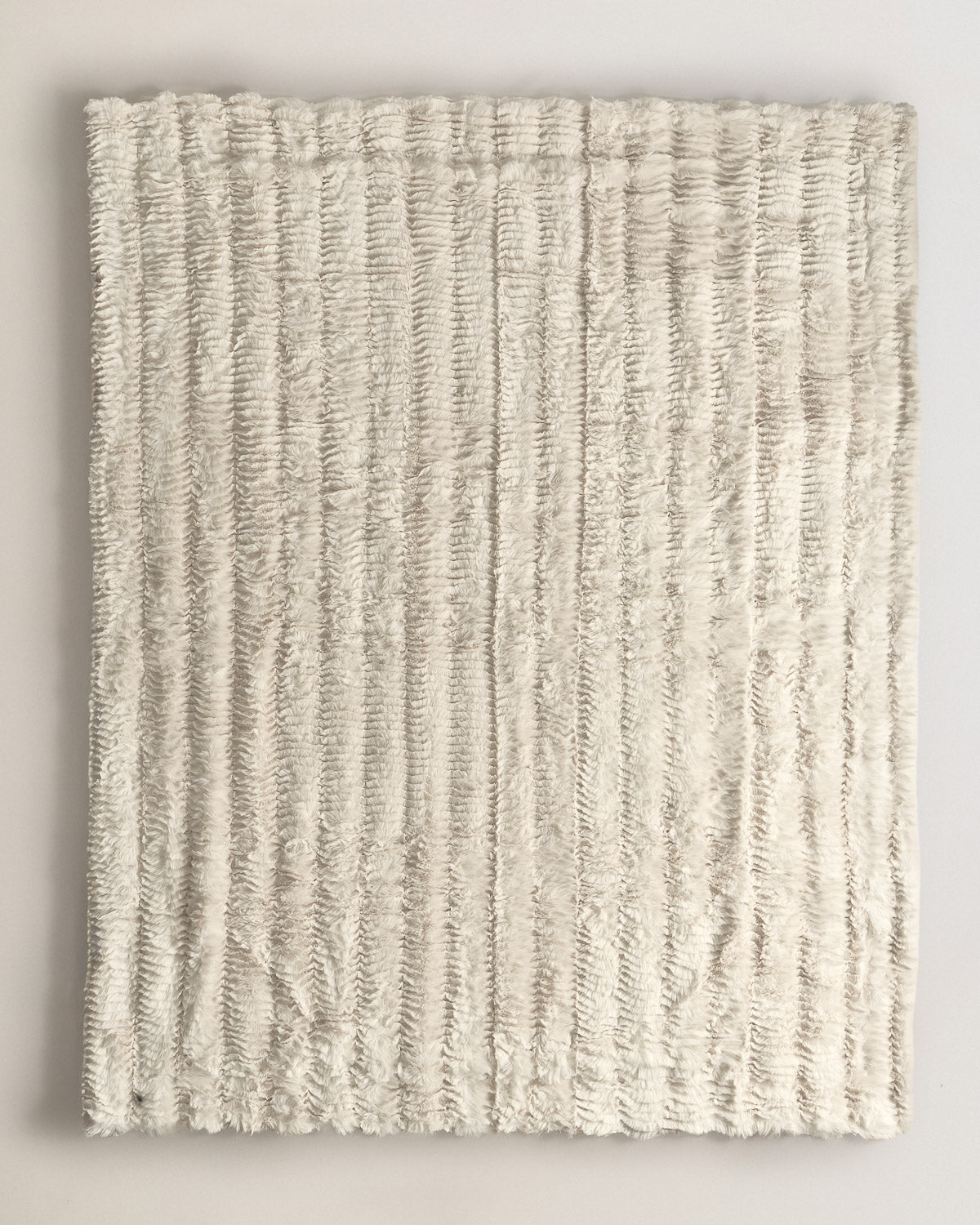 Manta efecto pelo ondas beige