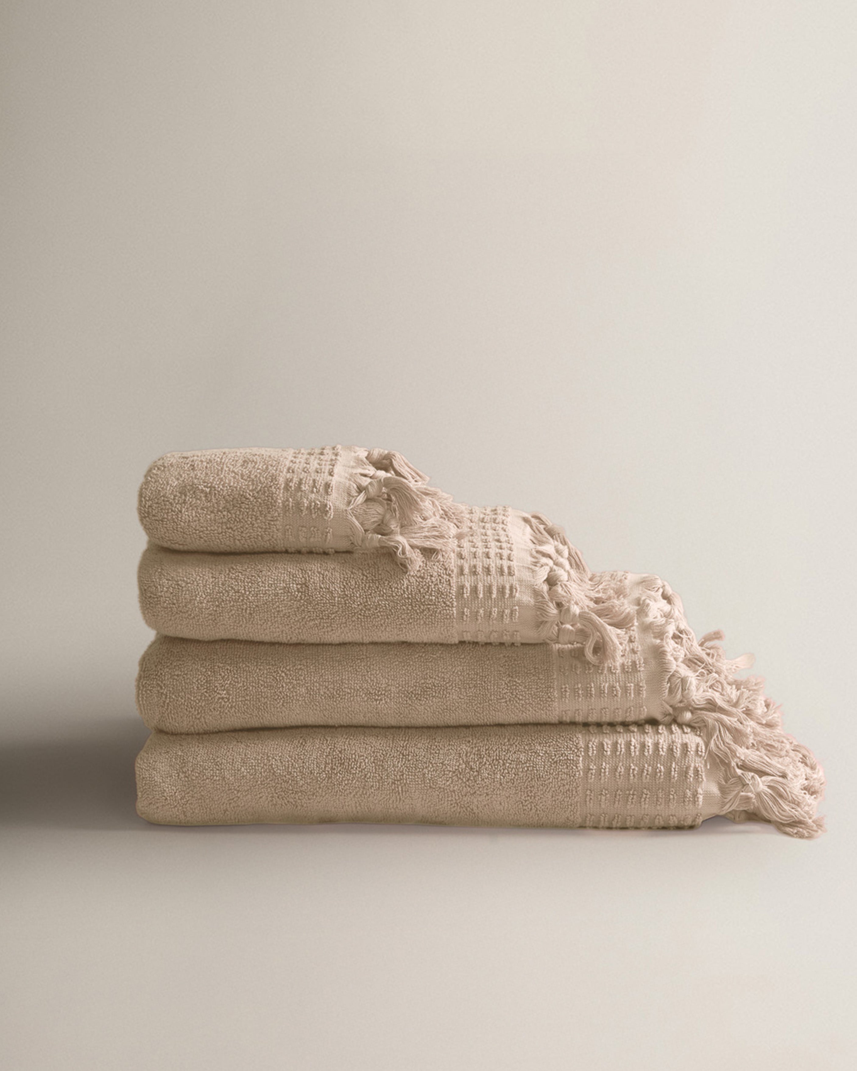 Serviette à franges unie 550 g Taupe