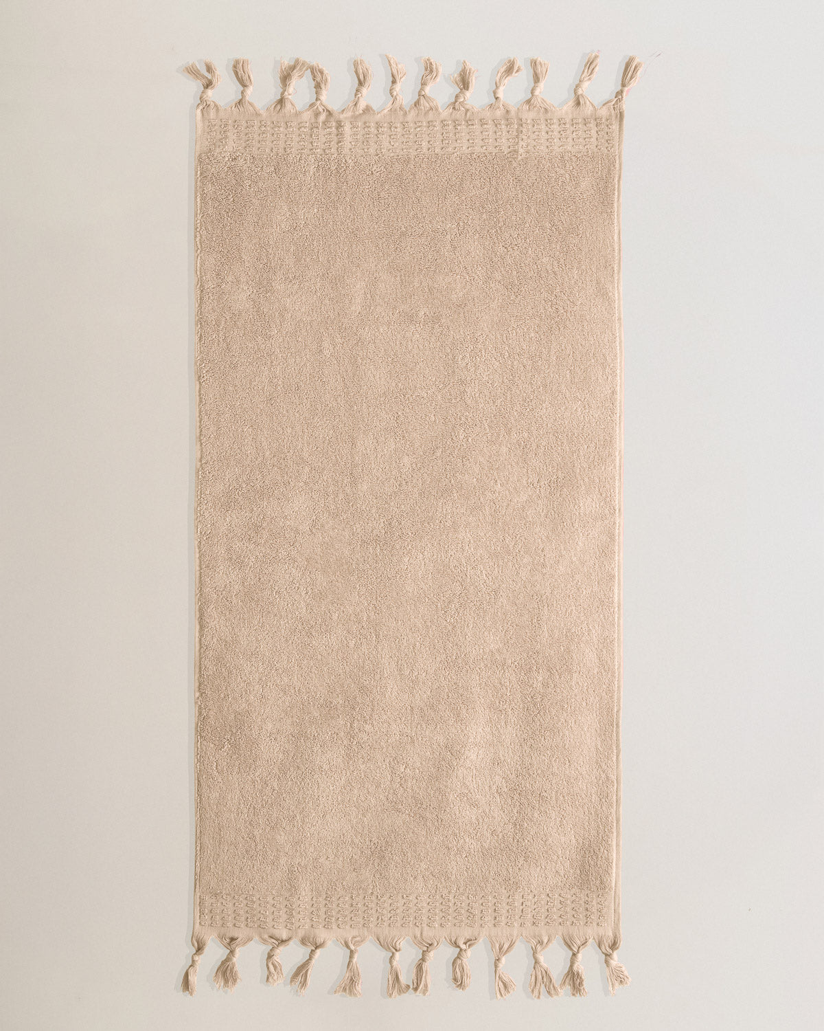 Serviette à franges unie 550 g Taupe