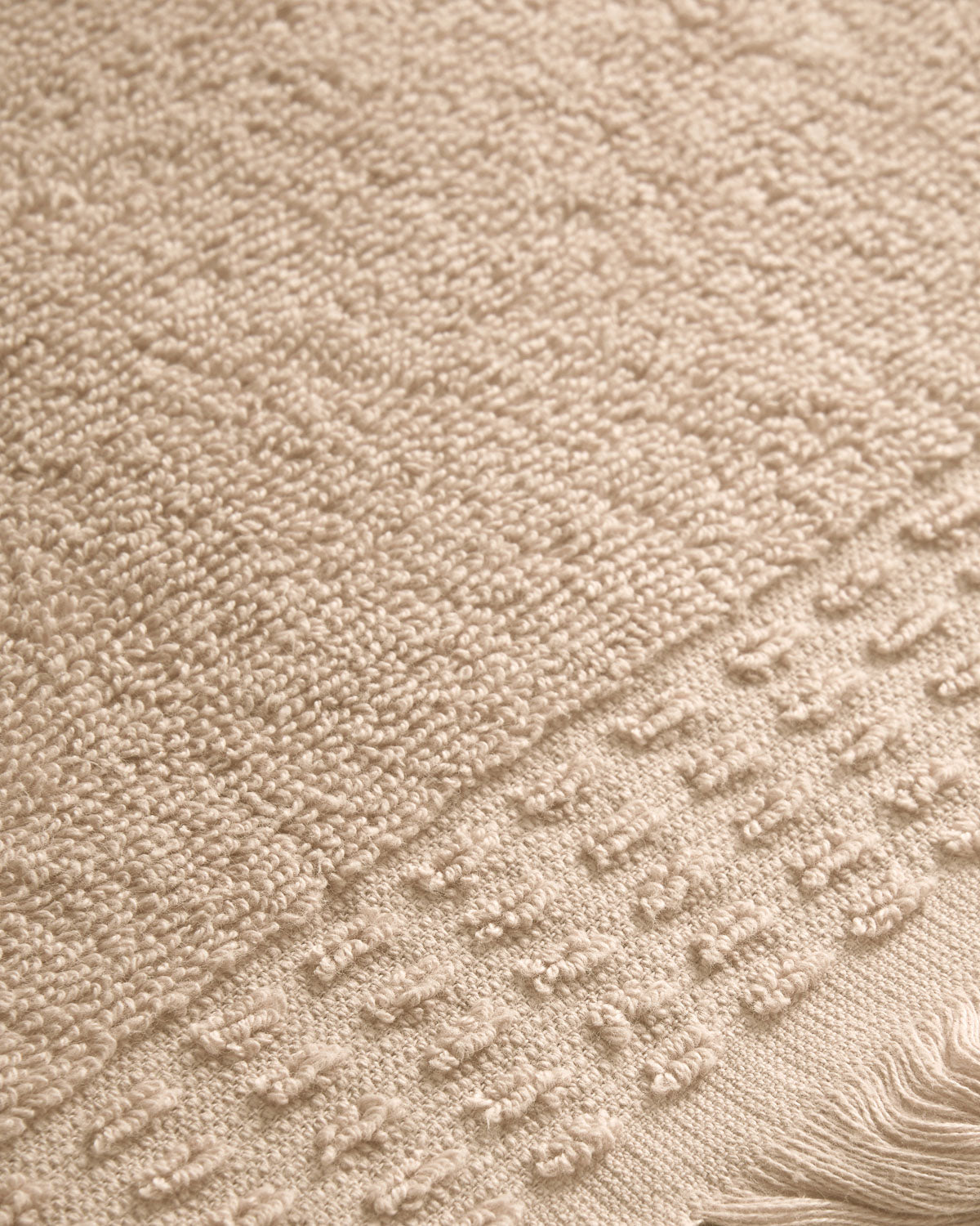 Serviette à franges unie 550 g Taupe