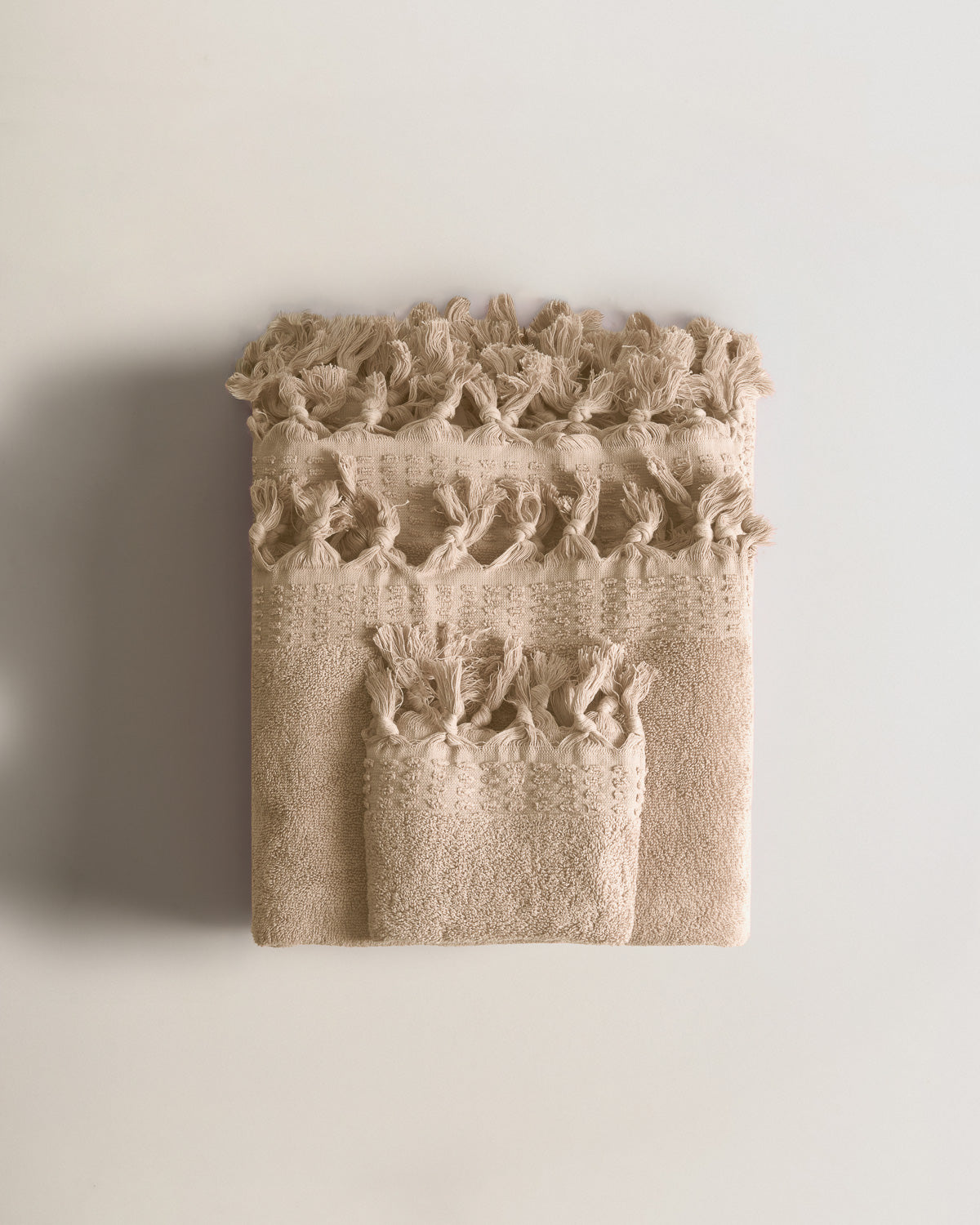 Serviette à franges unie 550 g Taupe