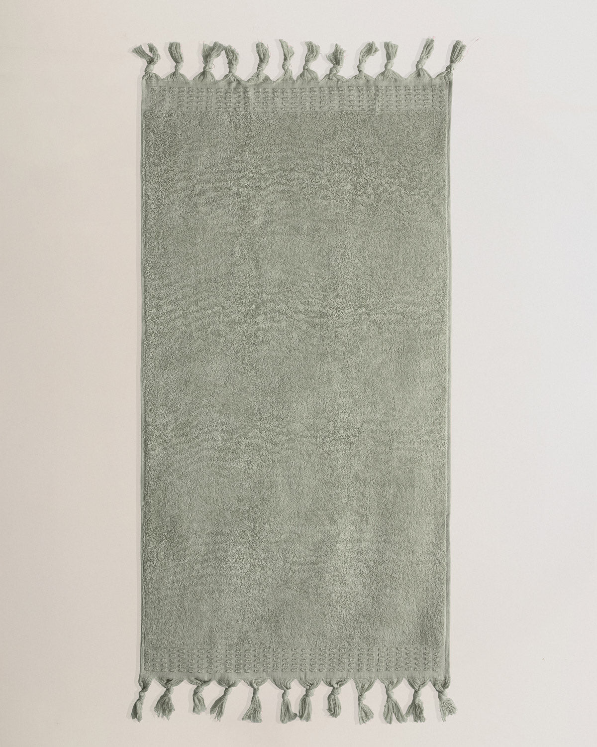 Serviette à franges unie 550 g Vert sec