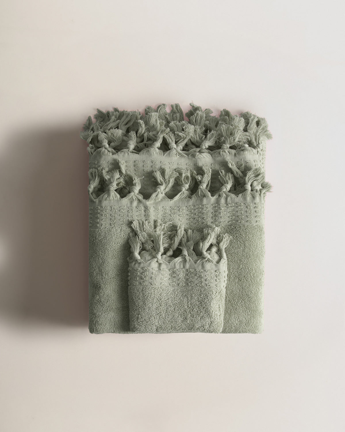 Serviette à franges unie 550 g Vert sec