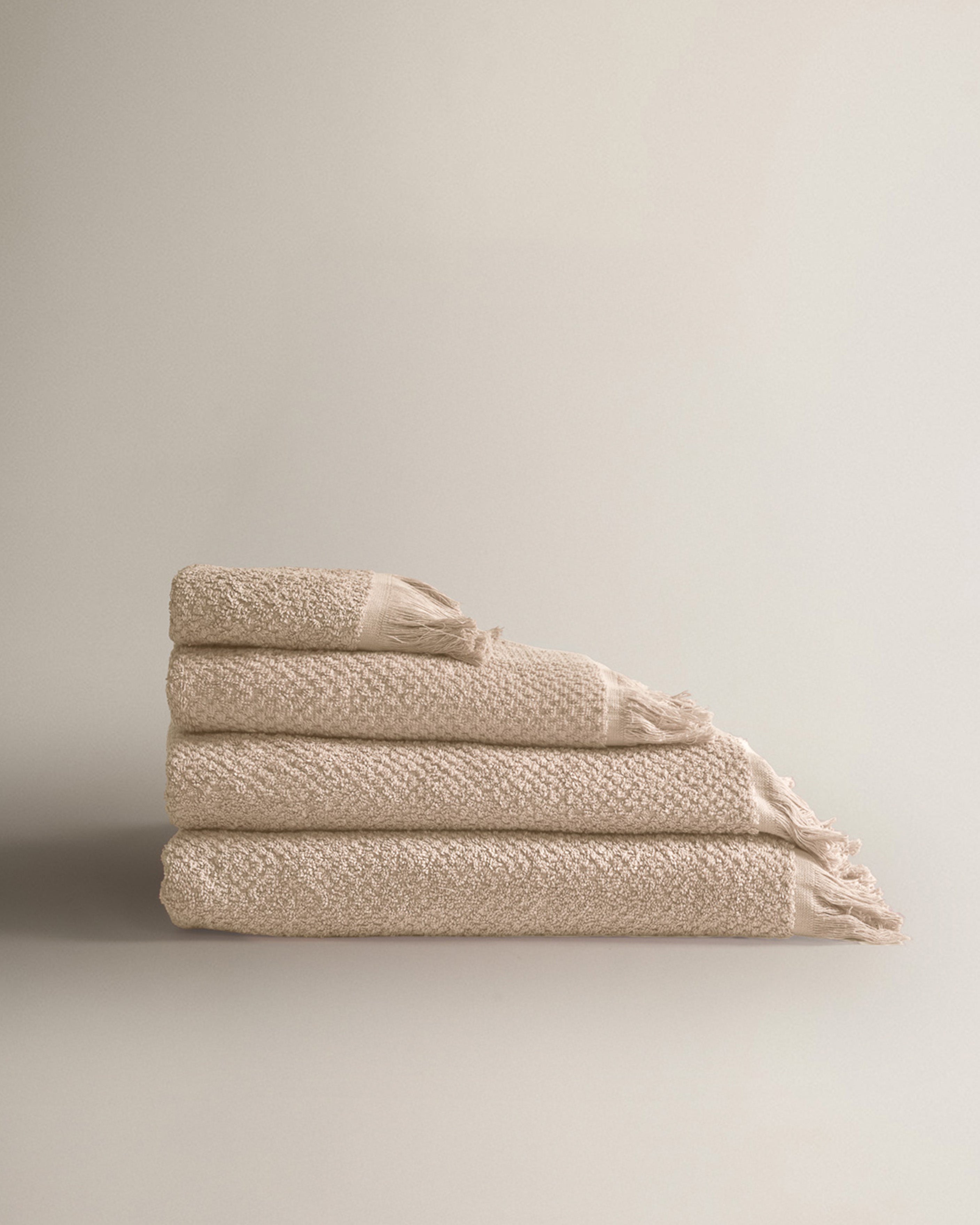 Serviette en chenille unie à franges, 550 g, taupe