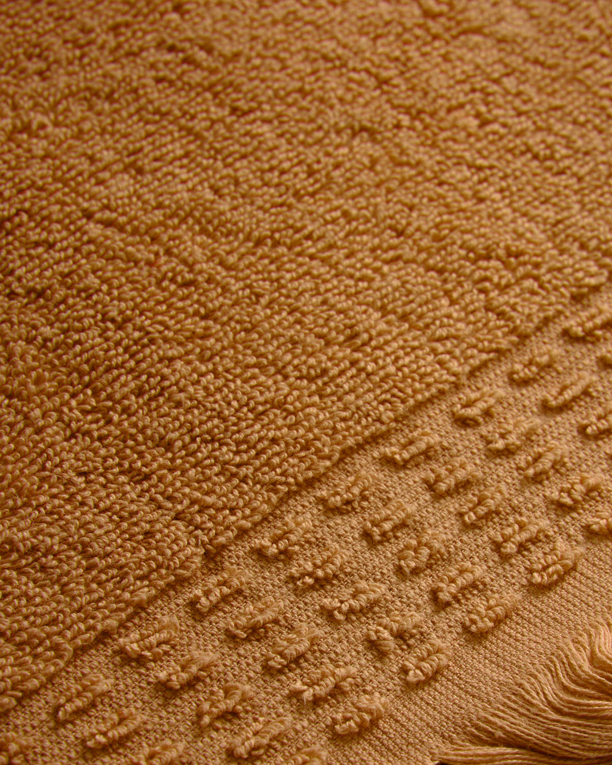 Serviette à franges unie 550 g ocre