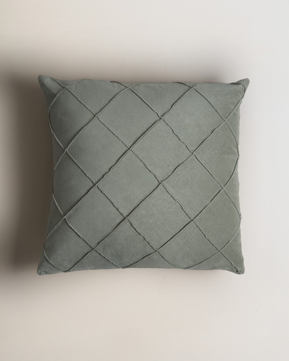 Coussin en velours de coton à motif losanges vert clair