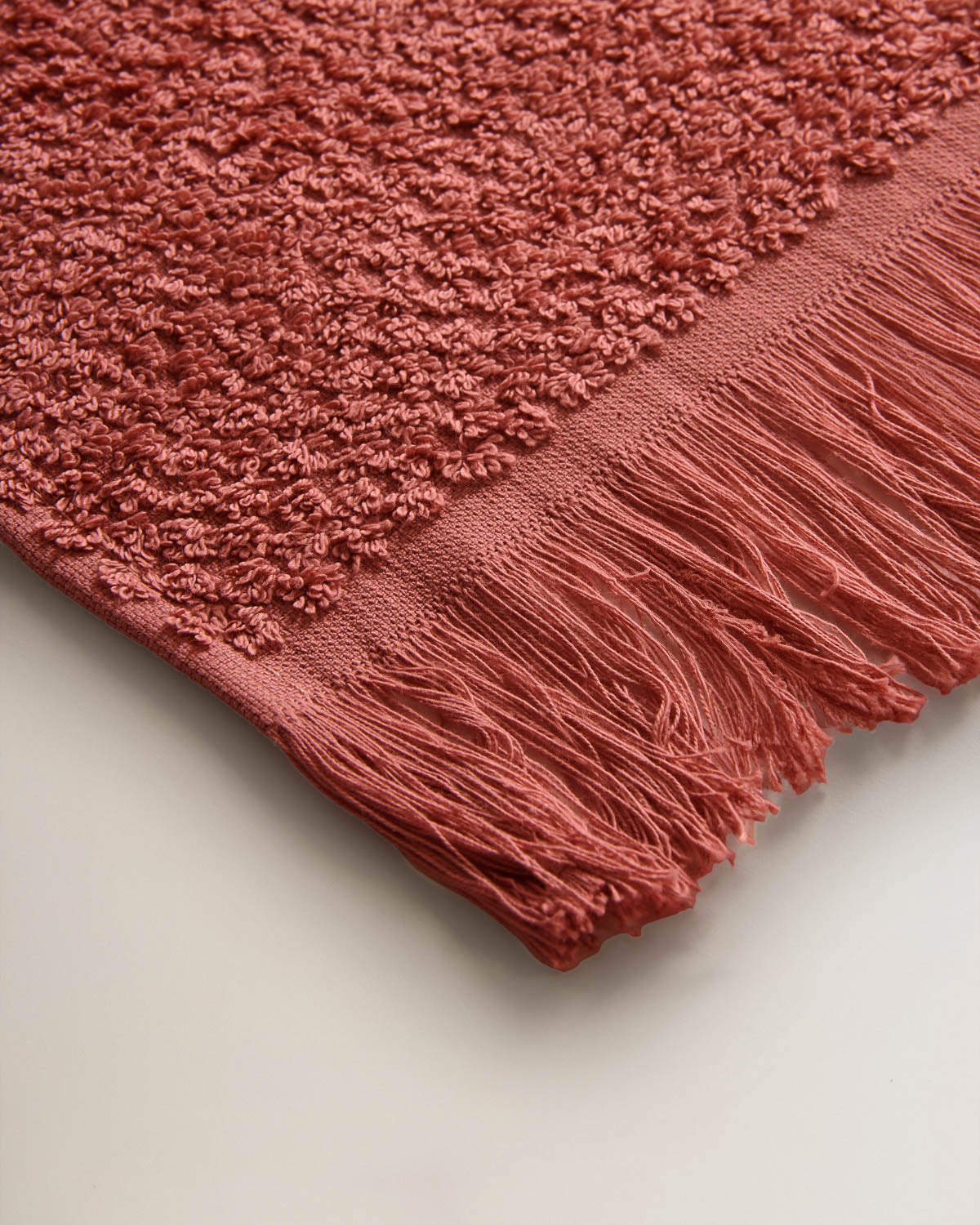 Serviette chenille à franges, unie, 550 g, rosette