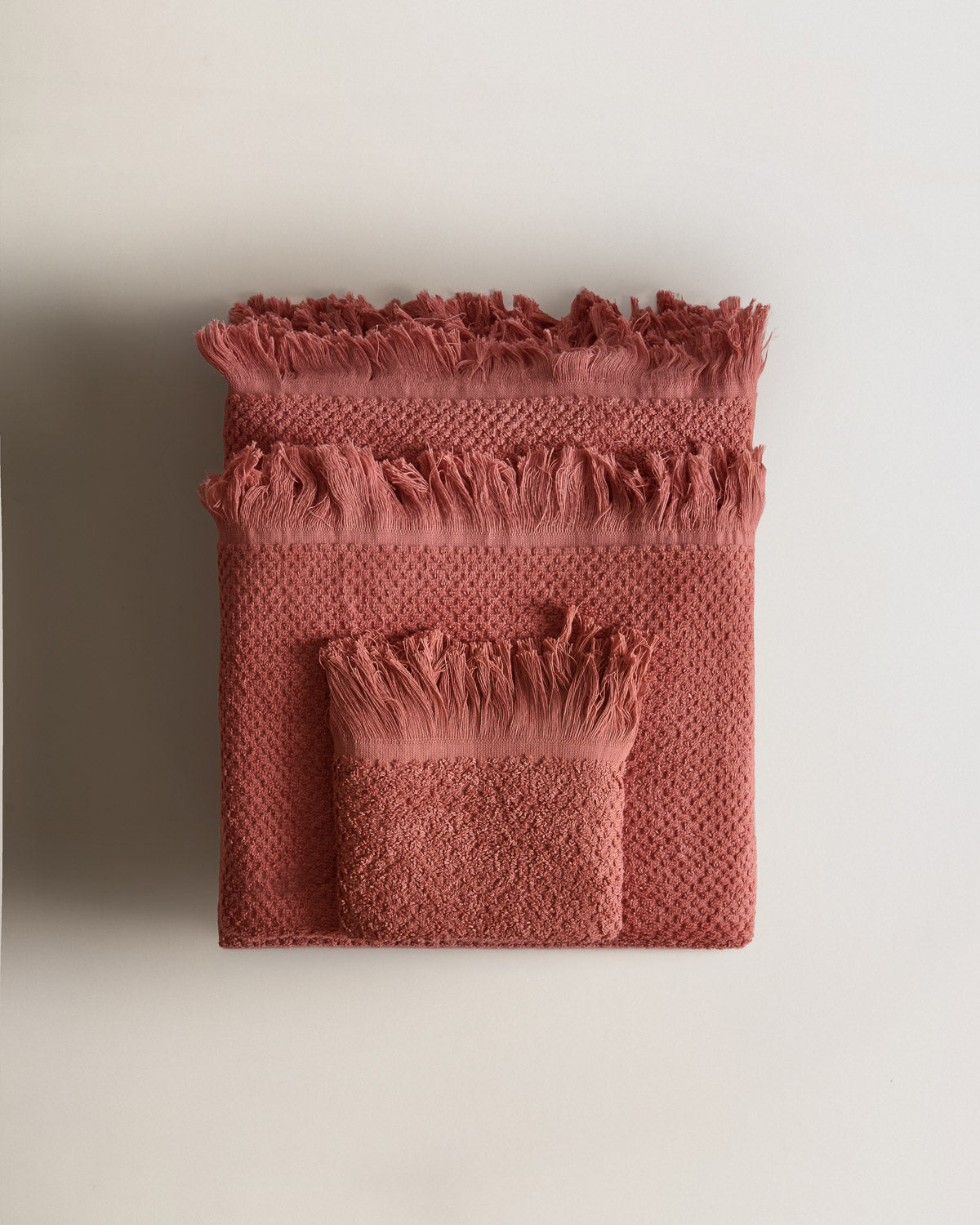 Serviette chenille à franges, unie, 550 g, rosette