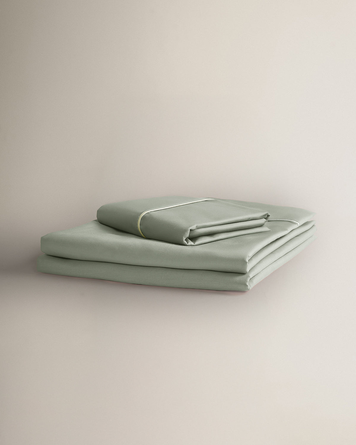 Ensemble de draps en percale de coton Keike avec passepoil vert