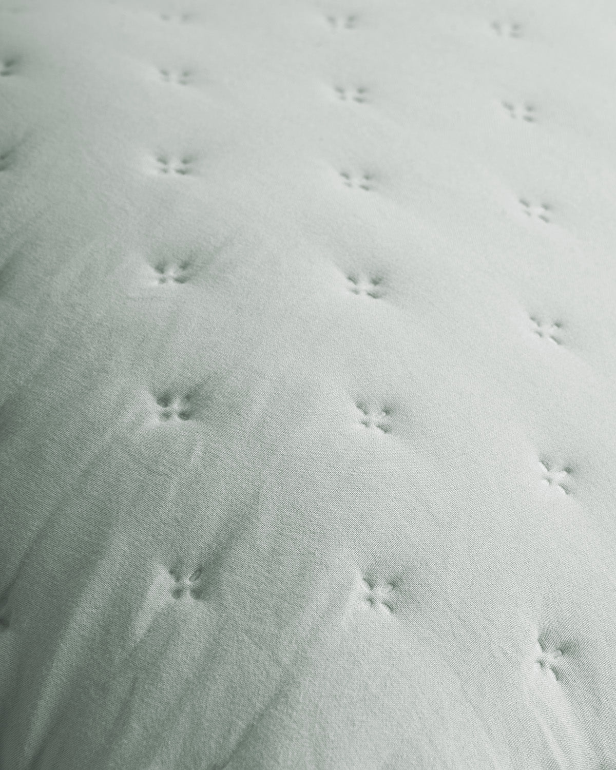 Coussin perforé vert uni Keike