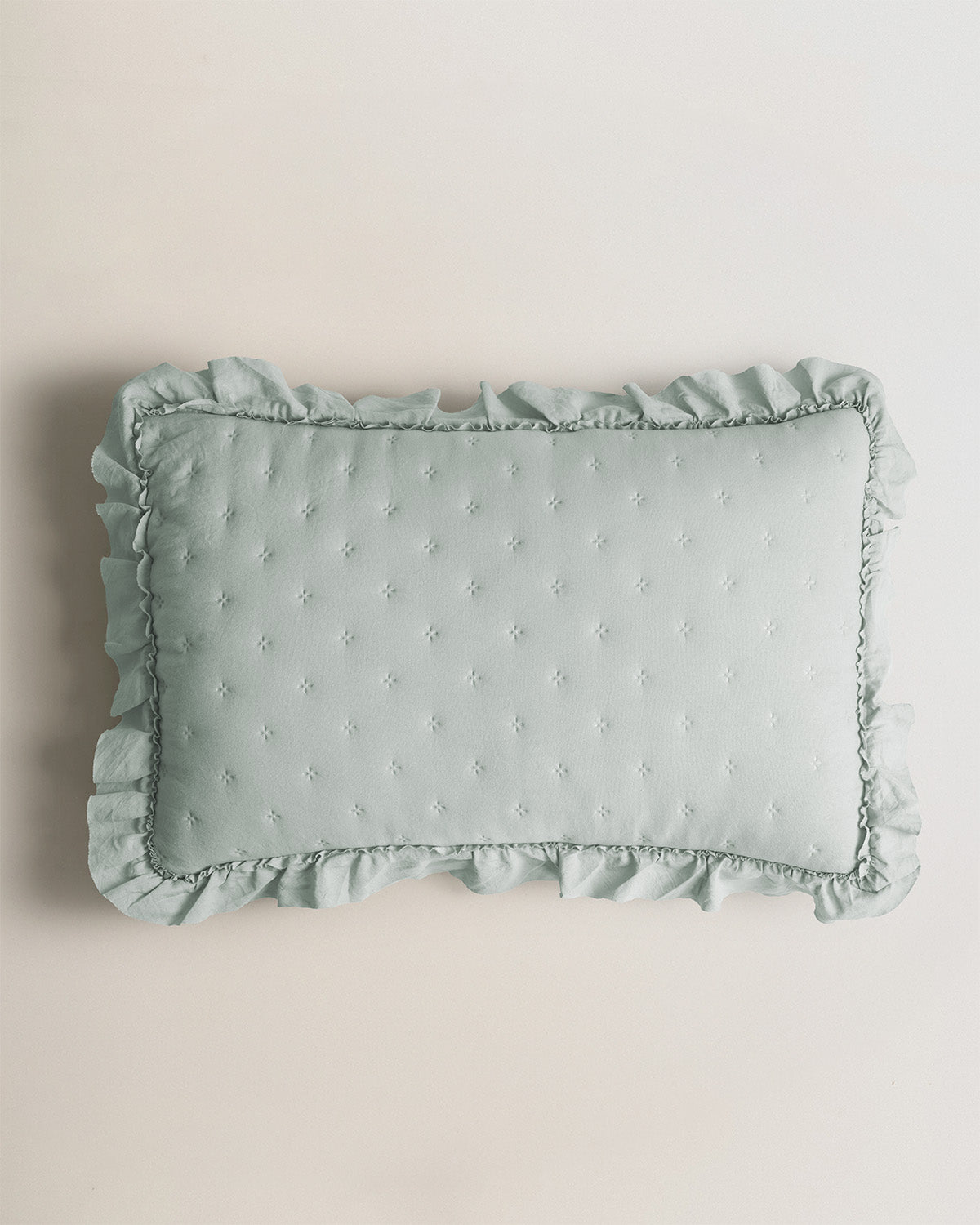 Coussin perforé vert uni Keike