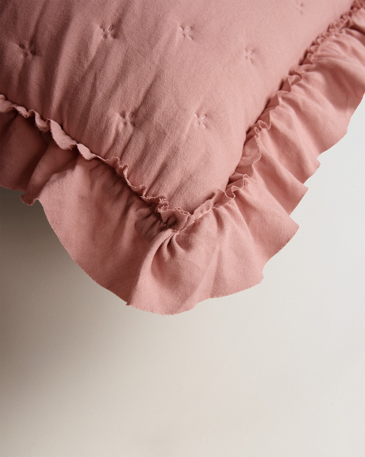 Rosette de coussin perforée simple
